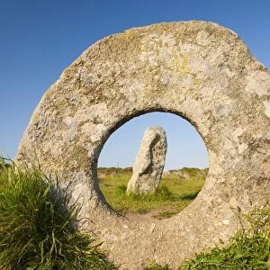 The famous Men an Tol stone near St Just in Cornwall, UK. This late Neolithic monument is thuoght to have been part of a now disappeared stone circle or an entrance to an old burial