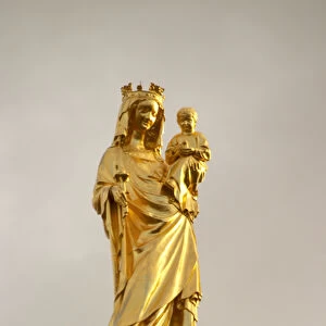 A golden madonna and child on the church tower of cathedral in bordeaux, newly renovated