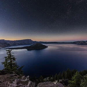 Night time stars over Crater Lake in Crater Lake National Park, Oregon, USA