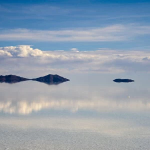 Reflection of clouds on the surface of the salt flat covered with water, Salar de Uyuni