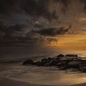USA, New Jersey, Cape May National Seashore. Cloudy sunset on seashore