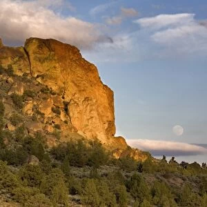 USA, Oregon, Smith Rocks SP. A full moon rises above the east side of Smith Rocks