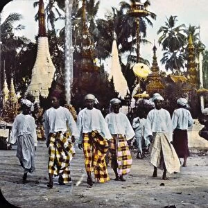 BURMA: STREET SCENE, c1895. A group of five men walking along the street, in native dress