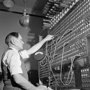 CHICAGO: TELEGRAPH BOARD. An operator at the switch board in the Pennsylvania Railroad