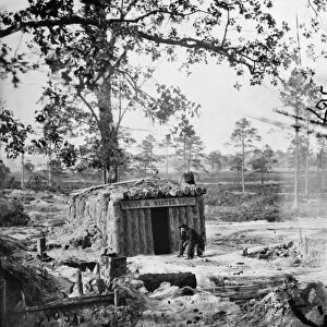 CIVIL WAR: RESTAURANT. Business seems to be slow at Sutlers bomb proof Fruit & Oyster House on the Union Army line at the siege of Petersburg, Virginia, June 1864 to March 1864. Photograph by Timothy H. O Sullivan