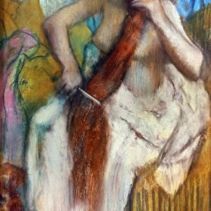 DEGAS: COMBING HAIR, 1887-90. Woman Combing Her Hair. Pastel on beige paper by Edgar Degas, 1887-90