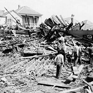 GALVESTON HURRICANE, 1900. Men searching among rubble for survivors following the