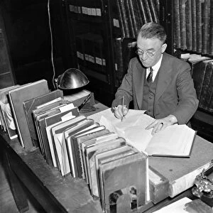 JOHN CLEMENT FITZPATRICK (1876-1940). American writer and historian, editing and compiling the writings of George Washington at the Library of Congress in Washington, D. C. Photograph, 1937
