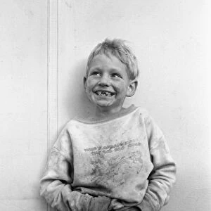 MIGRANT CHILD, 1938. Migrant child in a Shafter camp, California. Photograph by Dorothea Lange