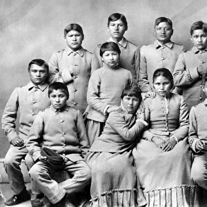 Native American students photographed after arriving at the Carlisle Indian Industrial School in Carlisle, Pennsylvania, late 19th or early 20th century