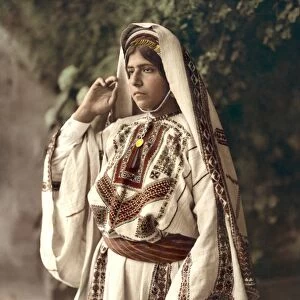RAMALLAH: WOMAN, c1919. A woman from Ramallah, north of Jerusalem. Hand-colored photograph
