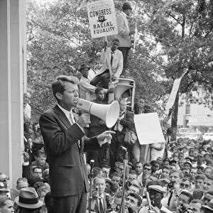 ROBERT F. KENNEDY (1925-1968). American lawyer and politician. Kennedy, while Attorney General, speaking at a demonstration by the Congress of Racial Equality outside the Justice Department in Washington, D. C. Photograph by Warren K. Leffler, 14 June 1963