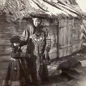 SIBERIA: TATARS, c1885. A Tatar woman and boy in a village near Minusinsk in Siberia