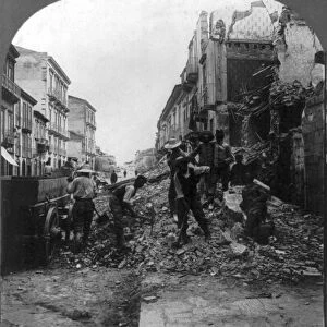SICILY: EARTHQUAKE, c1909. Men clearing away the rubble on route to Catane, Messina
