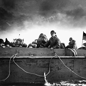 Soldiers on an American Coast Guard landing barge heading towards a Normandy beach on D-Day, 6 June 1944