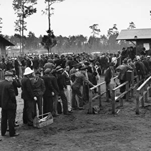 Unemployed carpenters and construction workers lined up outside the office of the State Employment Service in Starke, Florida. Photographed by Marion Post Wolcott, December 1940