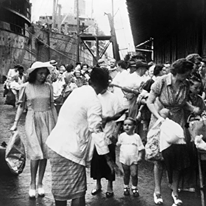 WWII: SINGAPORE, 1942. Women and children evacuating from Singapore before the