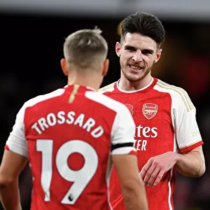 Arsenal FC vs Burnley FC: Interaction Between Rice and Trossard during the 2023-24 Premier League Match