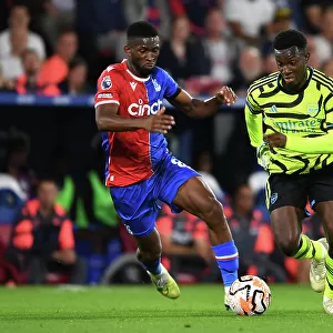 Arsenal's Nketiah Faces Pressure from Crystal Palace's Lerma in Premier League Clash