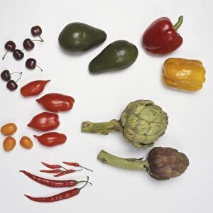 Two bell peppers, two globe artichokes, two avocados, cherries, red peppers, red chilies and loquat