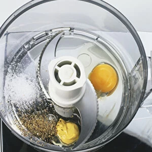 Egg, mustard, salt and pepper in a food processor