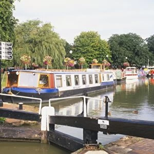Great Britain, England, Warwickshire, Stratford-Upon-Avon, boat filled canal basin with tree lined causeway