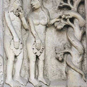 Italy, Emilia Romagna Region, Modena, marble bas-relief depicting temptation of Adam and Eve on Cathedral facade