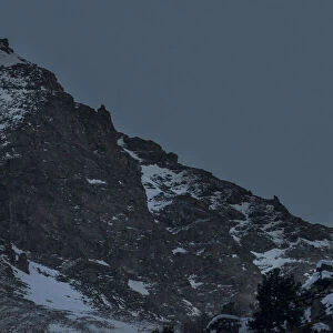 The nearly full moon rises in the evening over the ridge of the Val di Rhemes, Val di Rhemes, Aosta Valley, Italy, Europe The nearly full moon rises in the evening over the ridge of the Val di Rhemes, Val di Rhemes, Aosta Valley, Italy, Europe
