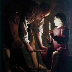 St Joseph the Carpenter. St Joseph in his workshop with the boy Jesus who is holding a candle