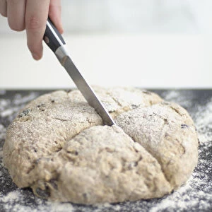 Using small kitchen knife to score soda bread