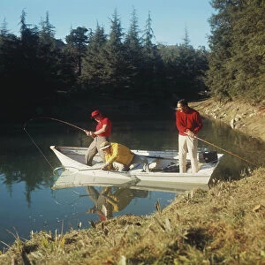 Men fishing in lake