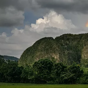 Rainbow over mogotes in ViAnales valley, in Cuba