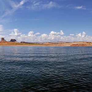 Red Navajo sandstone cliffs, rock formations, rising from Lake Powell, Page, Arizona, USA