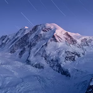 star trail over snow mountain
