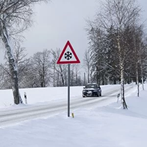 Traffic sign at a snow-covered road in winter, Upper Bavaria, Bavaria, Germany