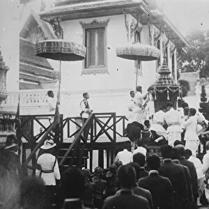 Cremation of late King of Siam. The golden urn with the kings body about to