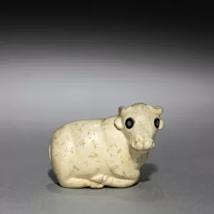 Amulet Seal in the Form of a Bull, c. 3250 BC (limestone with black stone inlaid eyes)
