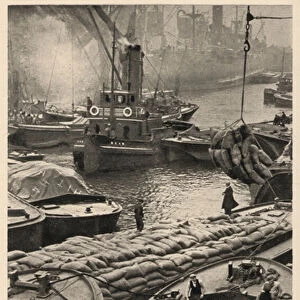 Boats and barges in the busy docks of the port of London (b / w photo)