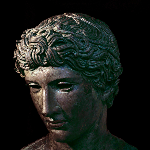 Bronze head of winner athlete wearing an olive crown. From Benevent, Italy