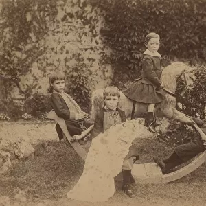 Children on rocking horse, c. 1890 (b / w photo)
