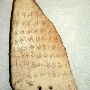 Clay tablet inscribed with Linear B script. Minoan dated to 1400 BC, from Knossos. Crete Clay tablet inscribed with Linear B script. Minoan dated to 1400 BC, from Knossos. Crete