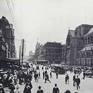 Corner of Swanston and Flinders Streets, Melbourne, showing St Pauls Cathedral (b / w photo)
