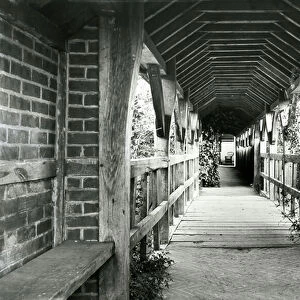 The covered approach to the house, Great Tangley Manor, from The English Manor House (b/w photo)