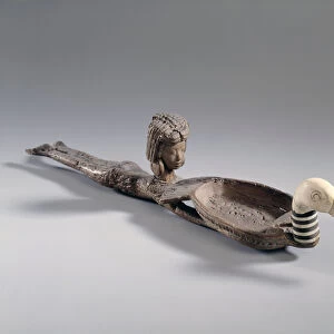 Egyptian antiquite: Wooden and ivory spoon for cosmetic spoon called a naked swimmer