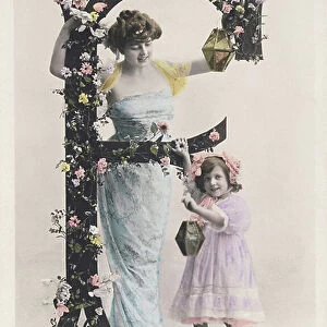 F: Capital letter decorated with flowers, a woman wearing a long cloth and a girl holding a lantern. 1907 (photograph)