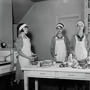 Girl Scouts Preparing Food in Kitchen, 1931 (b/w photo)