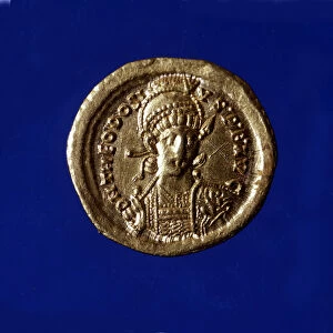 Gold coin with the effigy of the Byzantine Emperor Theodosius II (401 - 450)