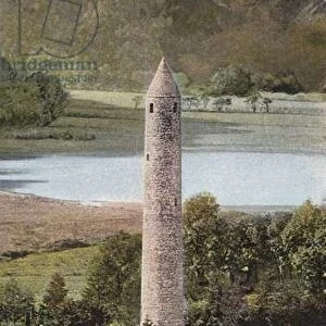 Ireland: Ancient Round Tower, Glendalough, County Wicklow (coloured photo)