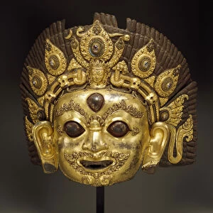 Mask of Bhairava (gilt copper repousse & gemstones)