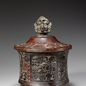 A Mayan lidded and carved tripod vessel, c. 250-450